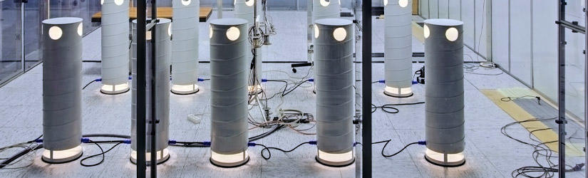 Experimental setup in the air flow laboratory with some dummies placed around a table